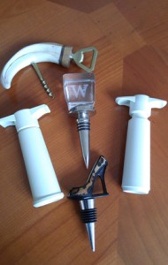 Photo of wine gifts: bottle stoppers, vacuum pumps and openers.